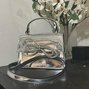 ALDO sparkly silver purse with bow